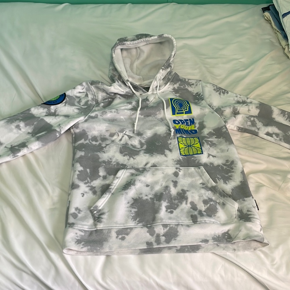 White and Grey Hoodie that is warm and has graphic designs.